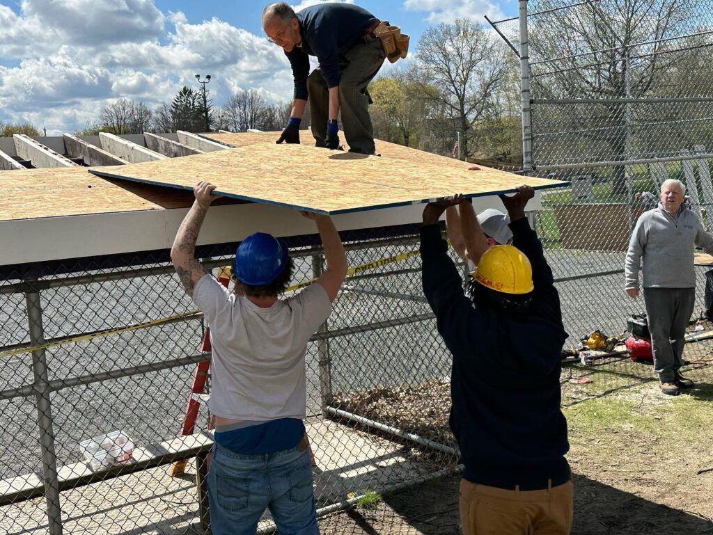 Volunteers Rebuild McPherson Park Dugout in Lowell